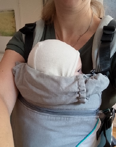 Tragehilfe Optimierung Kopfstütze Atmung Baby Tragen
